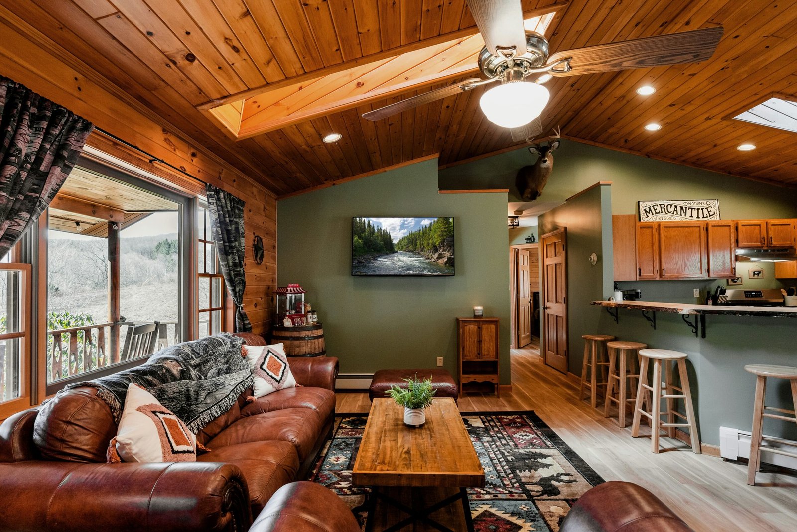 Bright, professionally staged luxury cabin living room representing the standard for top-performing Park City Airbnb listing photos.