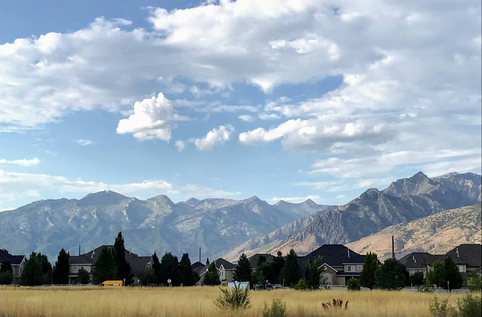 Aerial view of Deer Valley Resort mountain terrain in summer, the setting for Nest Luxury Properties vacation rental management.