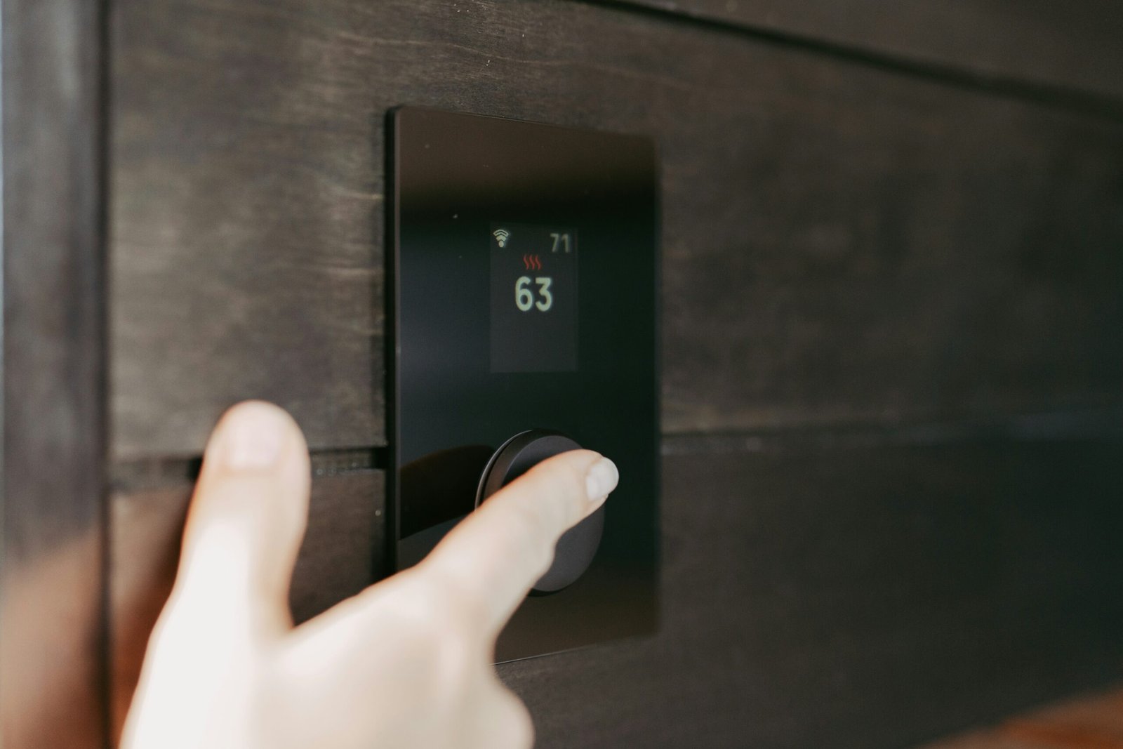 Modern smart lock keypad on the front door of a luxury vacation rental, the type used by Park City short-term rental hosts.
